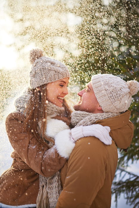 A couple embracing in the snow