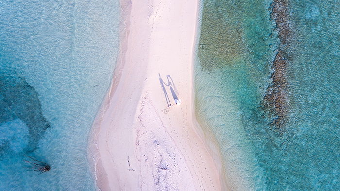 A wedding drone photography on a pink sand beach