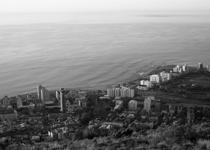 A black and white aerial photography of a seaside city