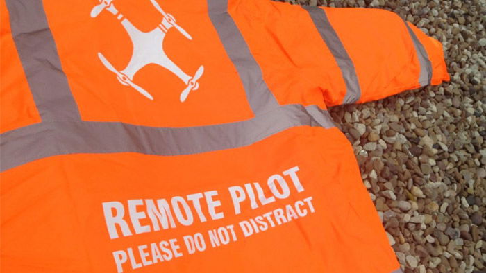 An image of a neon drone pilot vest