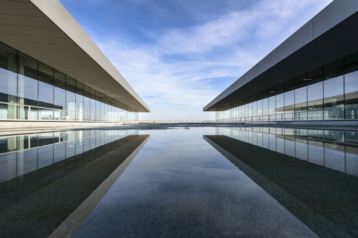 Architecture photography of two modern buildings in symmetry.