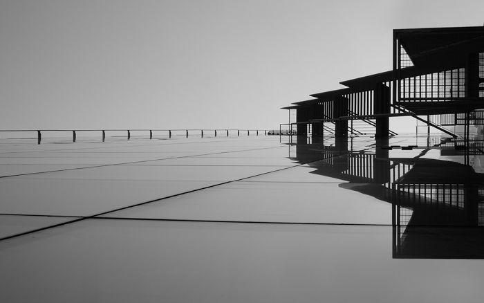 black and white image of lines leading eye to building