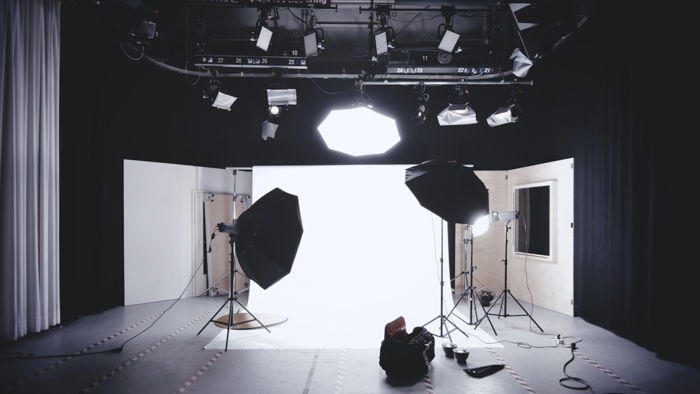 A set with various camera and lighting equipment.