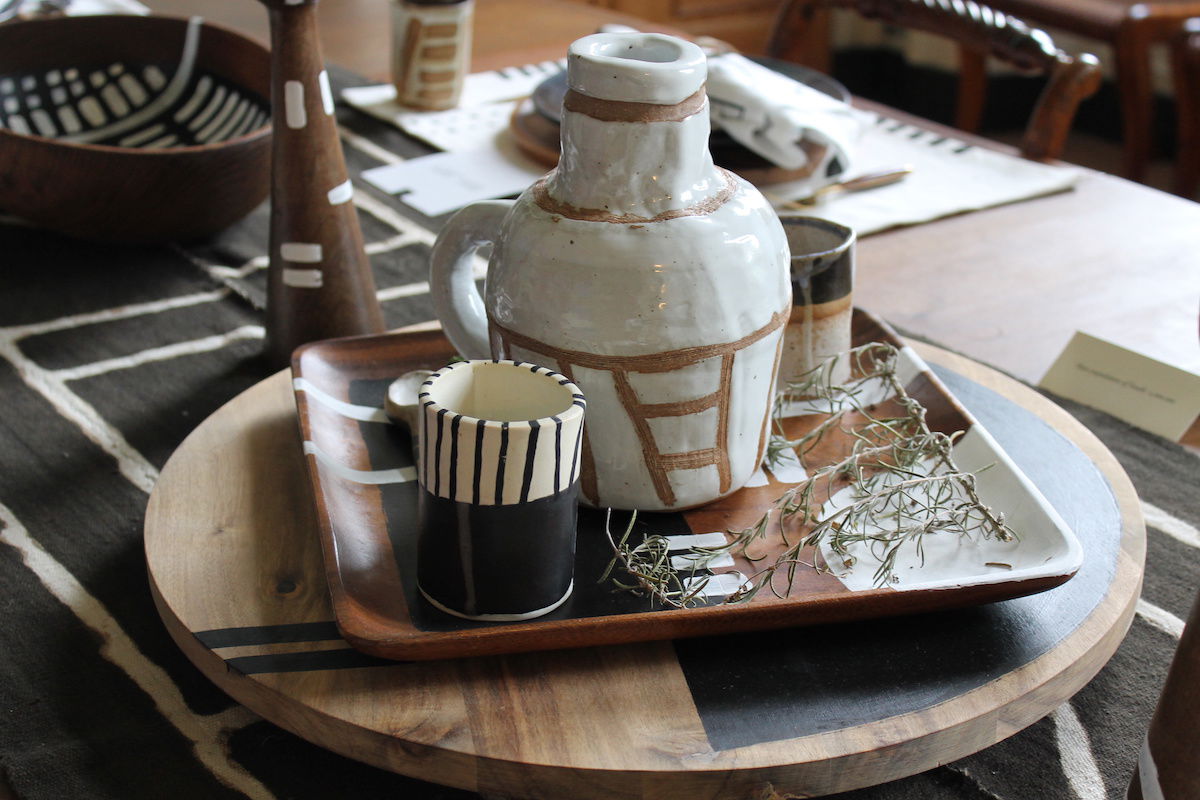 A lazy Susan with pottery on a kitchen counter