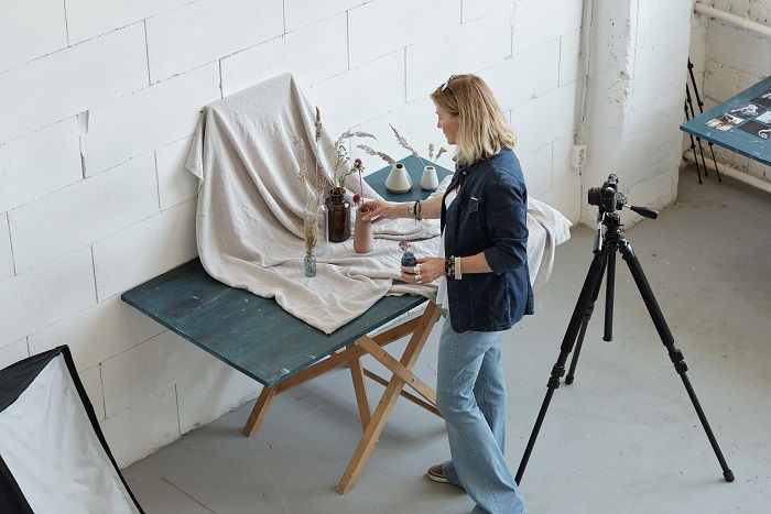 high angle photo of a woman creating a composition for photography