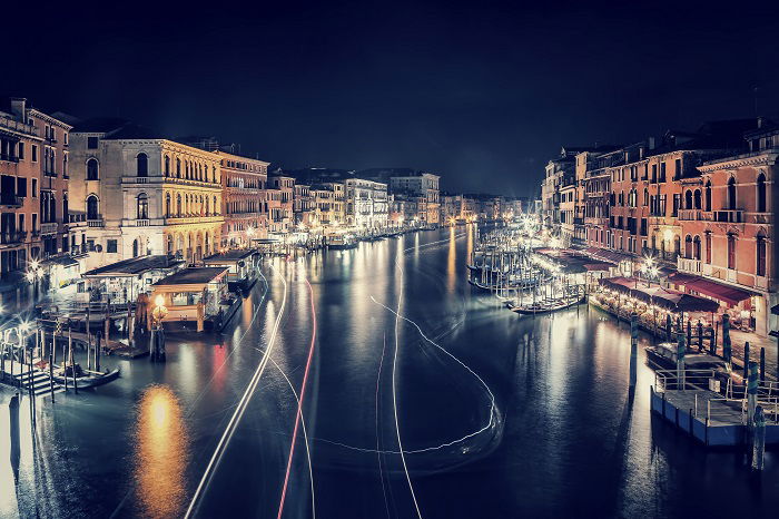 a timelapse photo of the grand canal in venice city at night