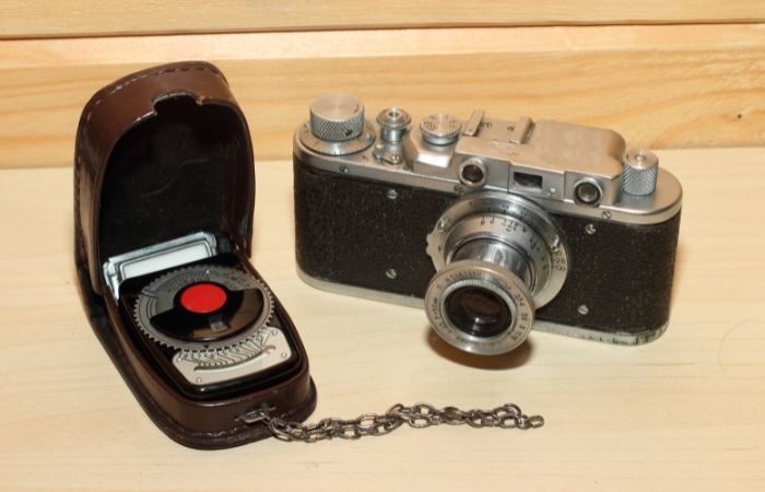 vintage film camera with light meter