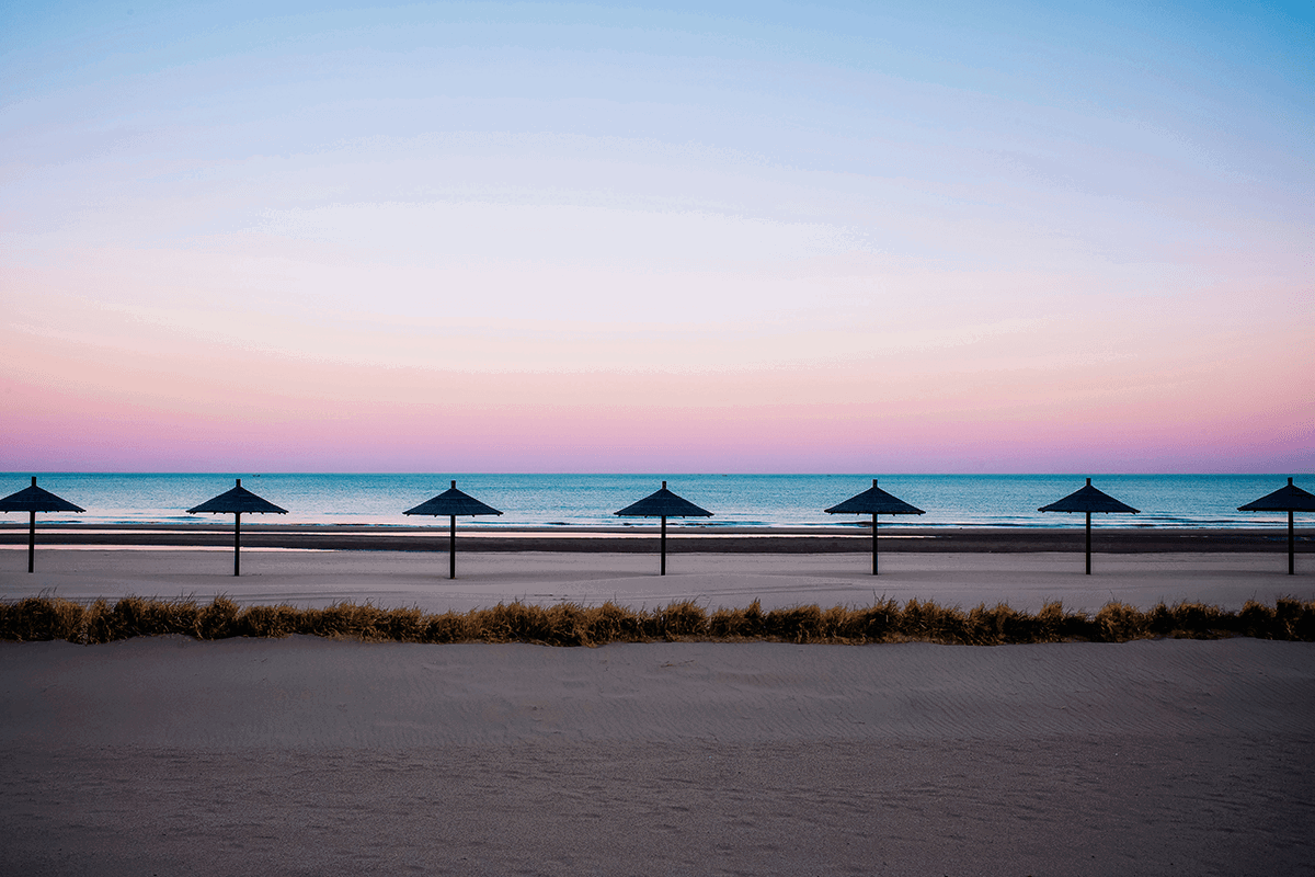 Symmetrical beach umbrellas showing visual weight