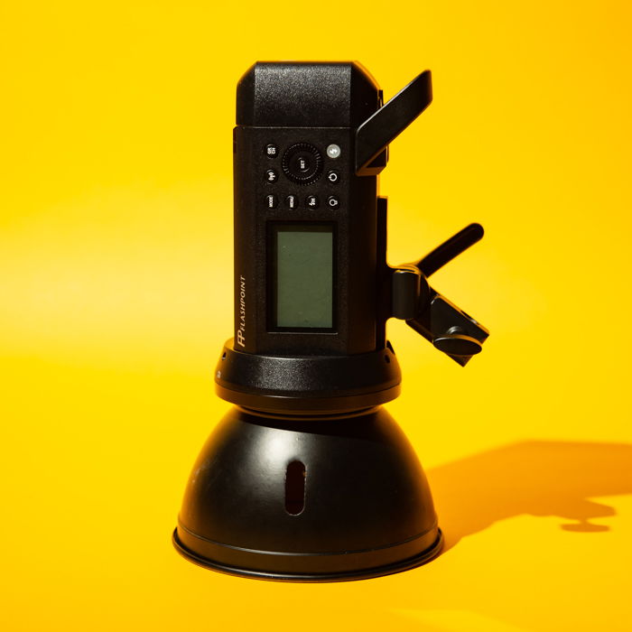 A monolight against a yellow background