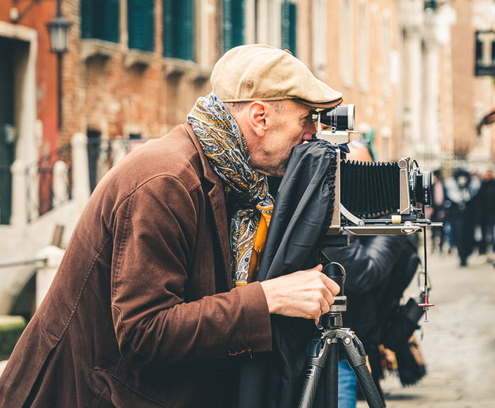 photographer with film camera