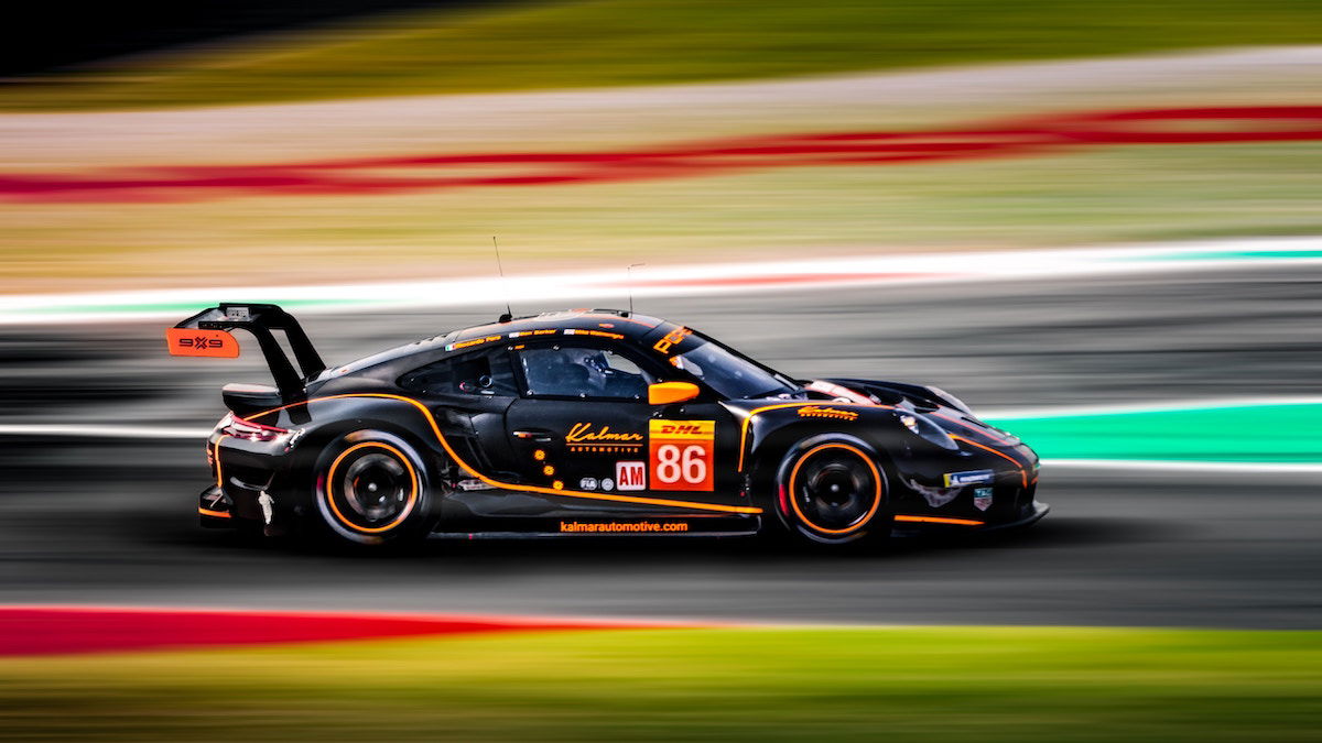 Colorful shot of a race car with a blurred foreground and background