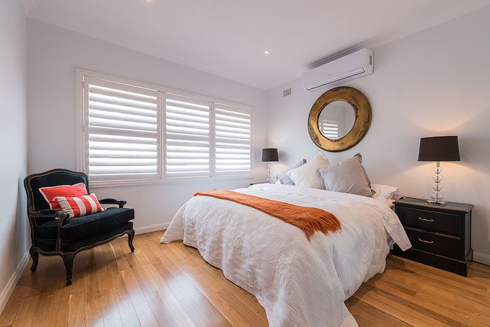 A bedroom interior with hardwood floor shot for real estate photography