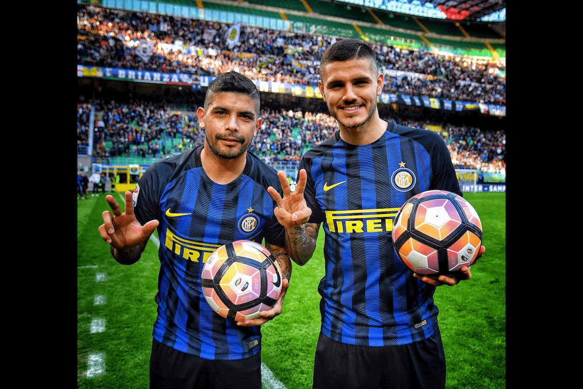 European football players holding soccer ball on the sidelines taken by one of the best sports photographers Claudio Villa