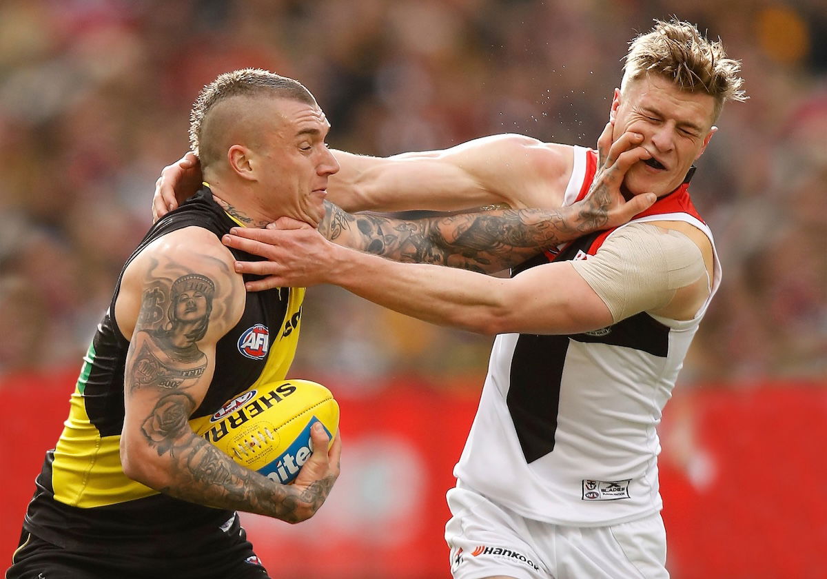 Australian football players grappling taken by one of the best sports photographers Michael Wilson