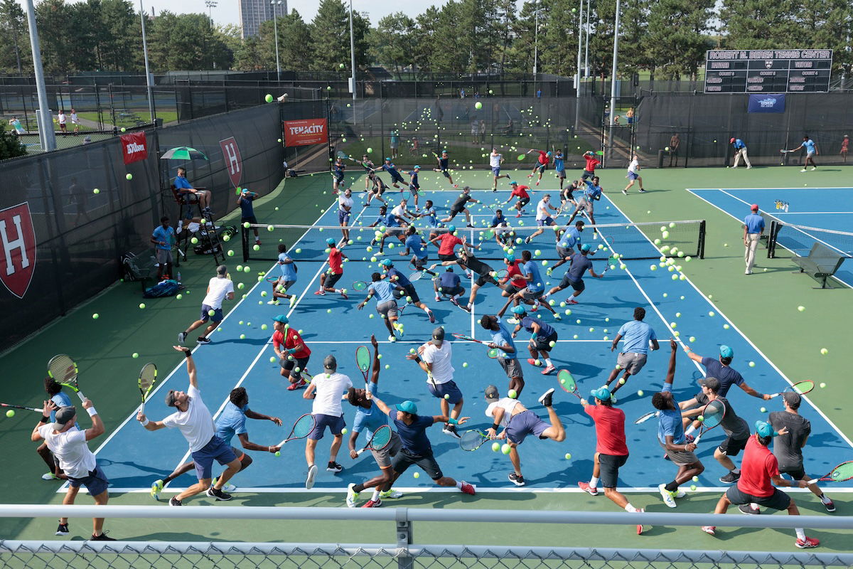 Multiple exposures of many tennis players on a tennis court taken by one of the best sports photographers Pelle Cass