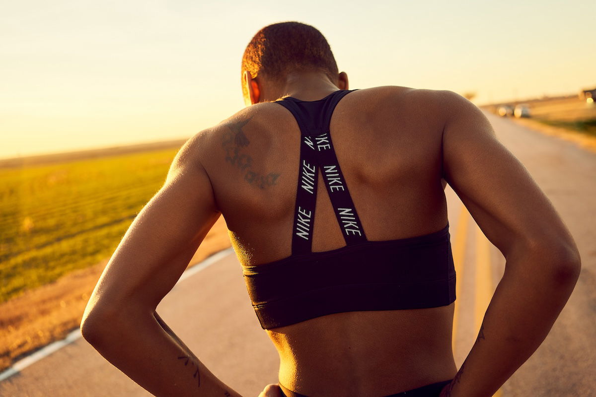 Lifestyle shot of the back of an athlete standing outside taken by one of the best sports photographers Philip Edsel