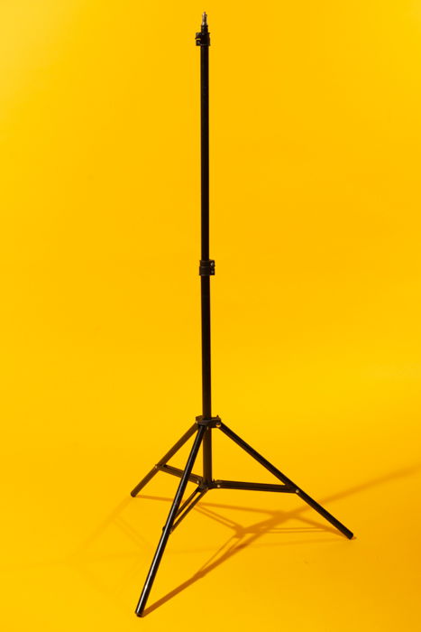 Light stand against a yellow background