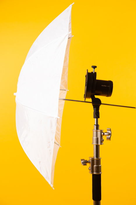 Umbrella against a yellow background