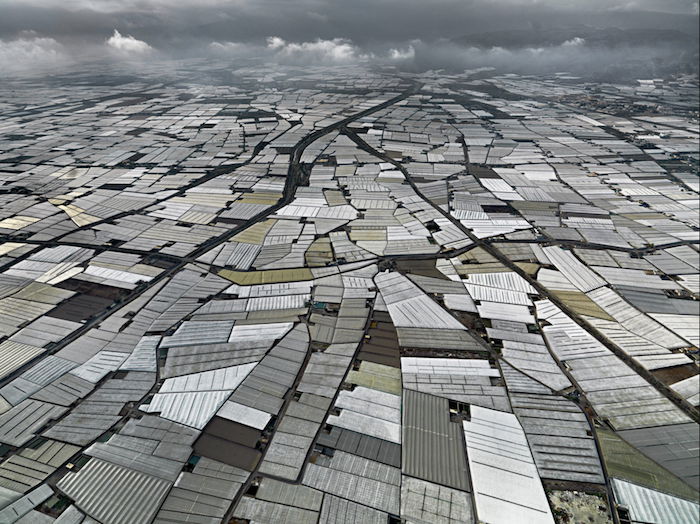 interesting composition for aerial landscape photography: aluminum rooftops for as far as the eye can see