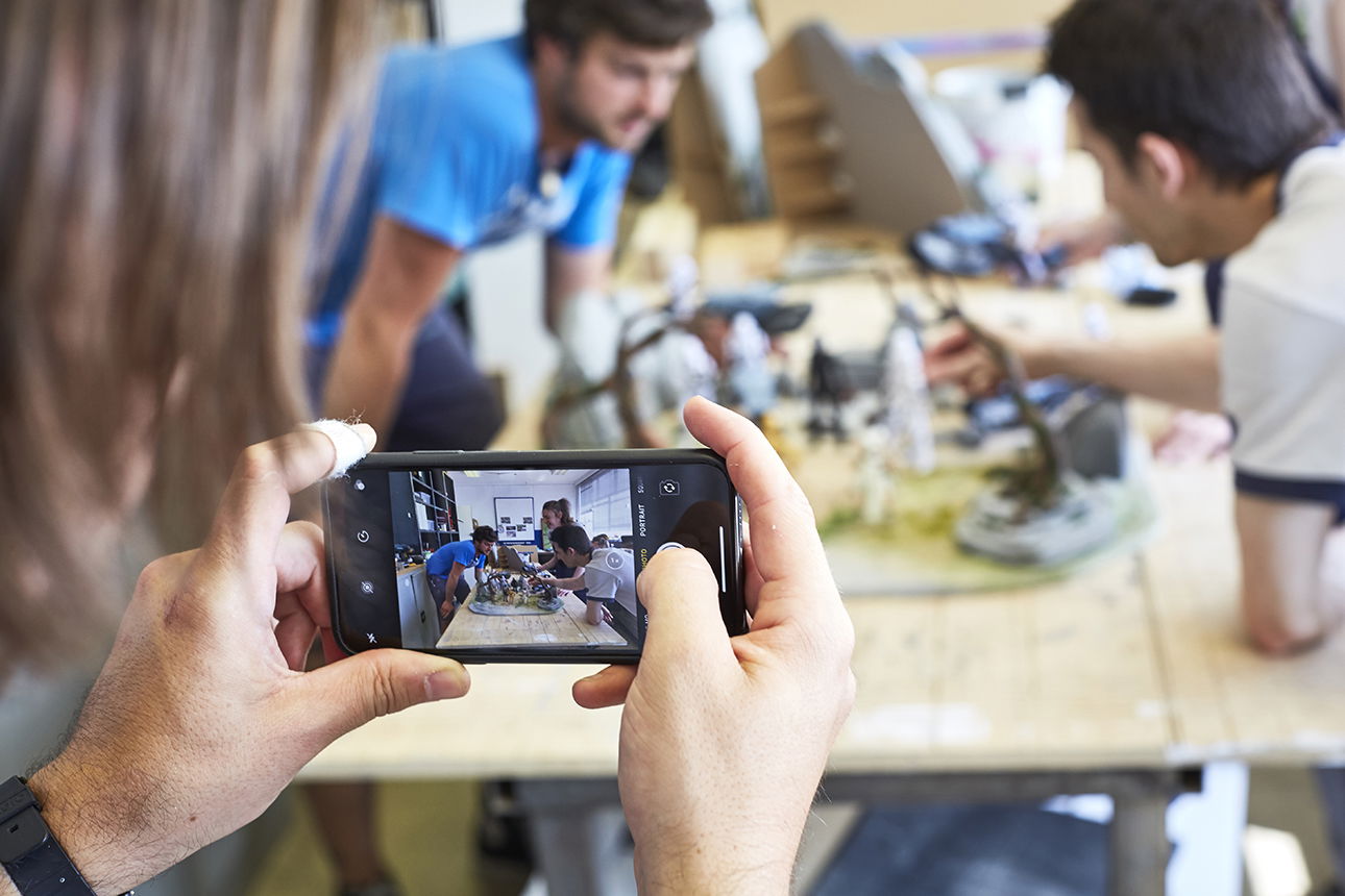 a behind the scenes shot of a home studio making miniature photography