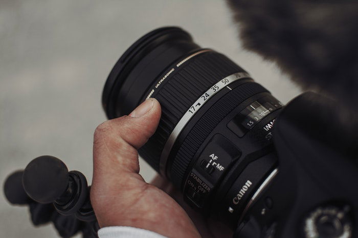 A person holding a camera.