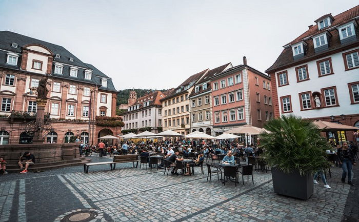 image of customers seated outdoors in a town square