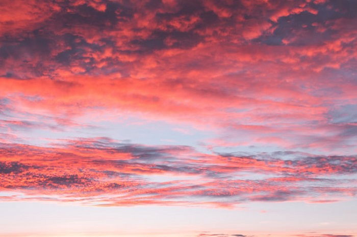 A colorful sunset over a cloudy skyr. 