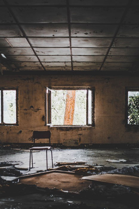 barren and damaged room in an abandoned building 