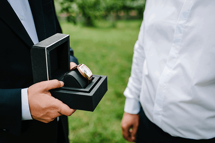 groomsmen photo idea: Giving groomsman a watch