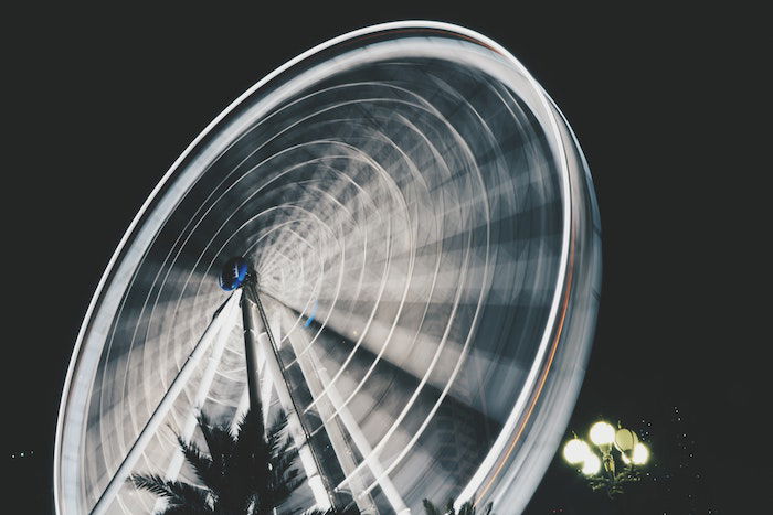 Repetition in photography: A long exposure photograph of a ferris wheel spinning and showing repetitive circular motion