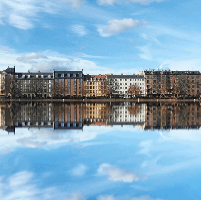 cityscape photography: Building, cloud, and blue sky reflections in Copenhagen Denmark 