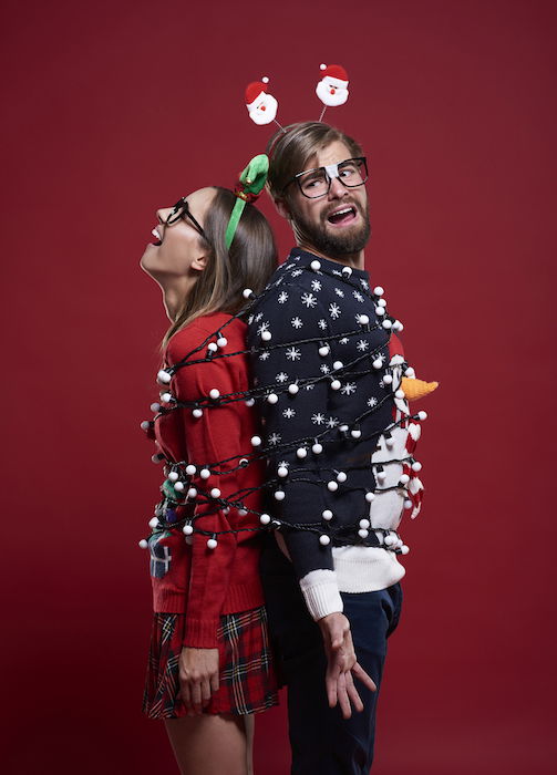 Couple wrapped in lights for Christmas photo ideas