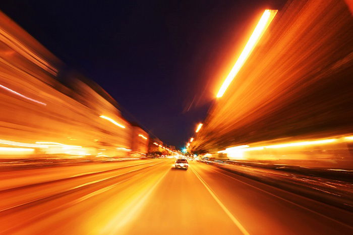 using a time-lapse calculator for time-lapse photos: photo from a moving car as light streaks fly by the sides of the photos