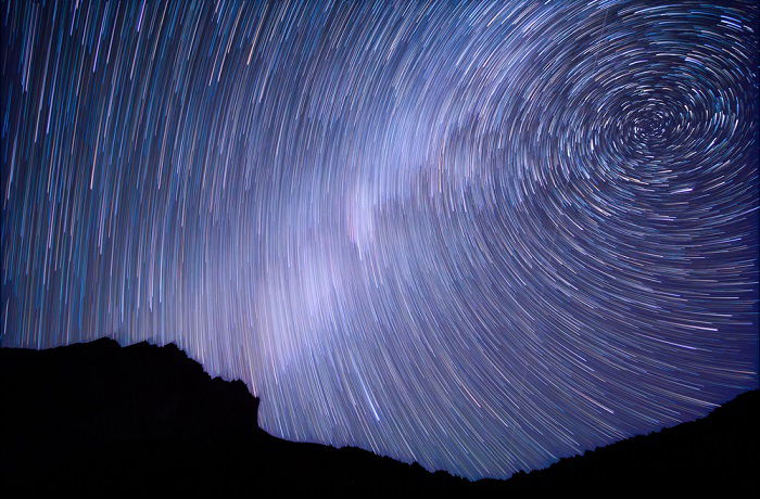 Circular star trails in a night sky for time-lapse photography