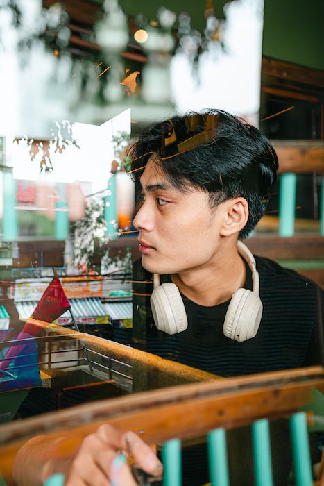 Portrait of a man through a window with a double exposure as a creative photoshop idea