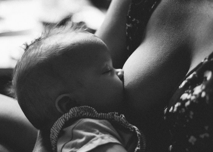 Baby feeding as newborn photo idea