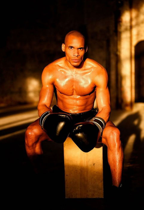 Sweaty boxer sitting in the light of a window