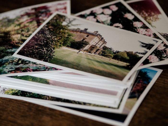 A pile of printed glossy photographs