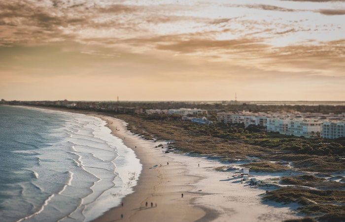 A miniature view of a beach at sunset