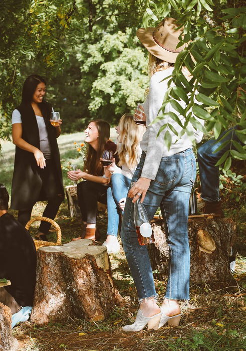 Group of girls enjoying a boozy picnic