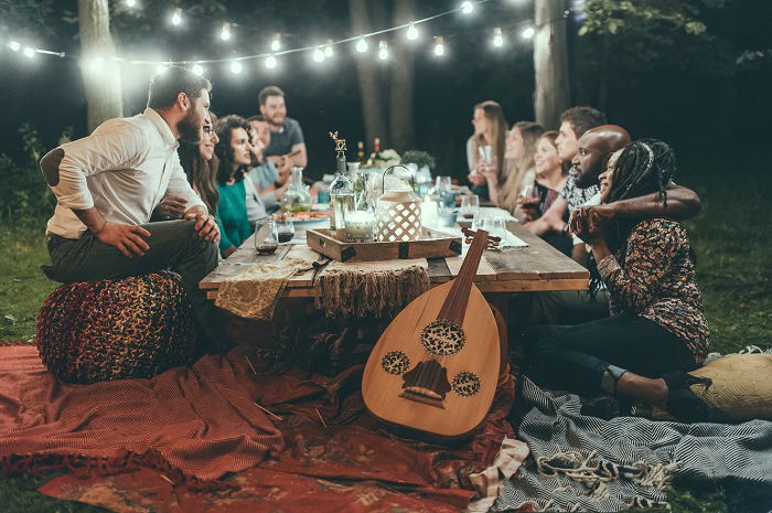 Big group of people enjoying a meal outside