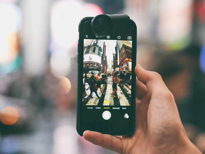 Smartphone camera taking a picture of a road crossing