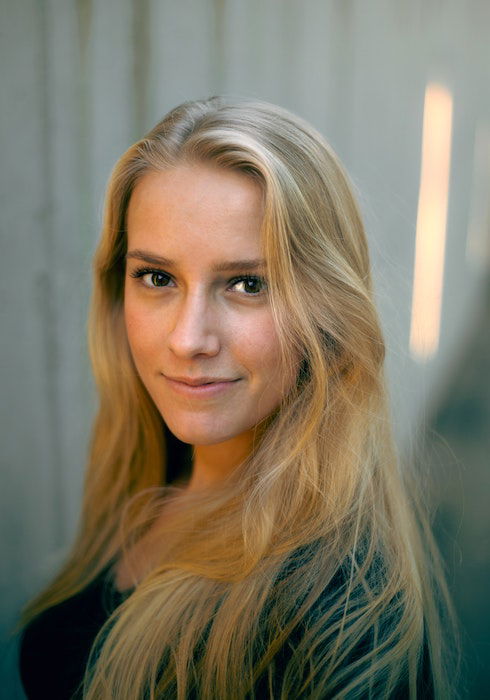 Warmly lit headshot of a woman