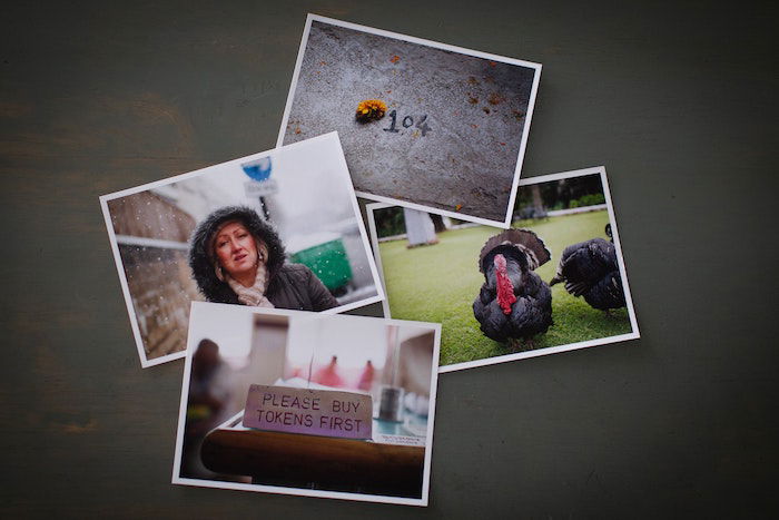 Flat lay of four photo prints