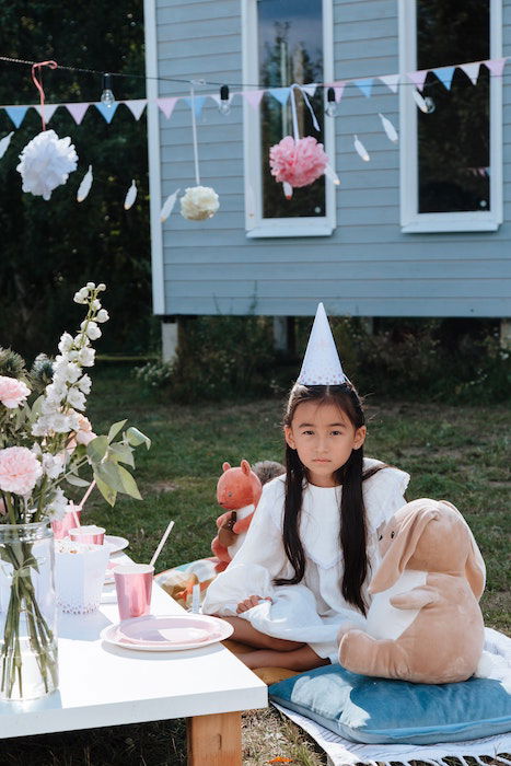 girl at her garden birthday party