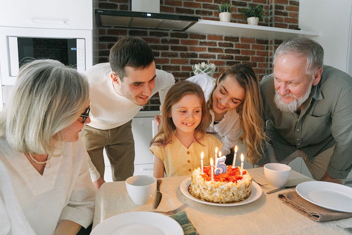 family gathered around birthday girl