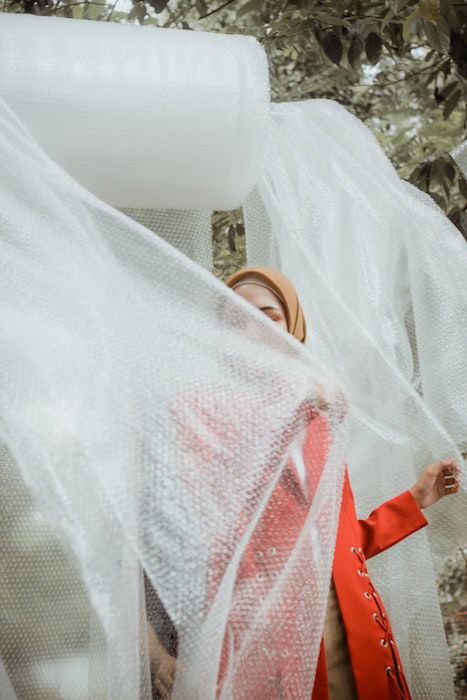 girl wrapped up in bubble wrap