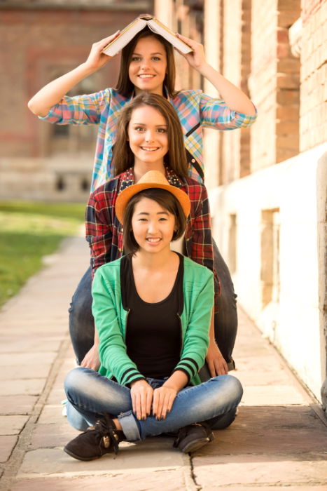 Three friends posing together