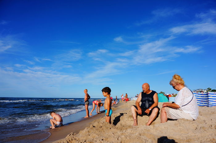 Family on the beach in bright sunshine