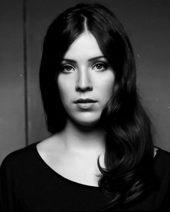 Portrait of a woman with dark hair on Rollei RPX 25